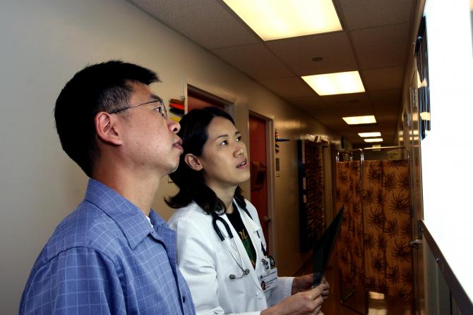 Doctors analyze patient scans